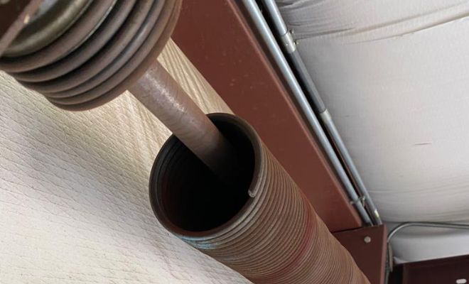 broken torsion spring img - Garage Tec | Automatic Gates & Garage Door Repair